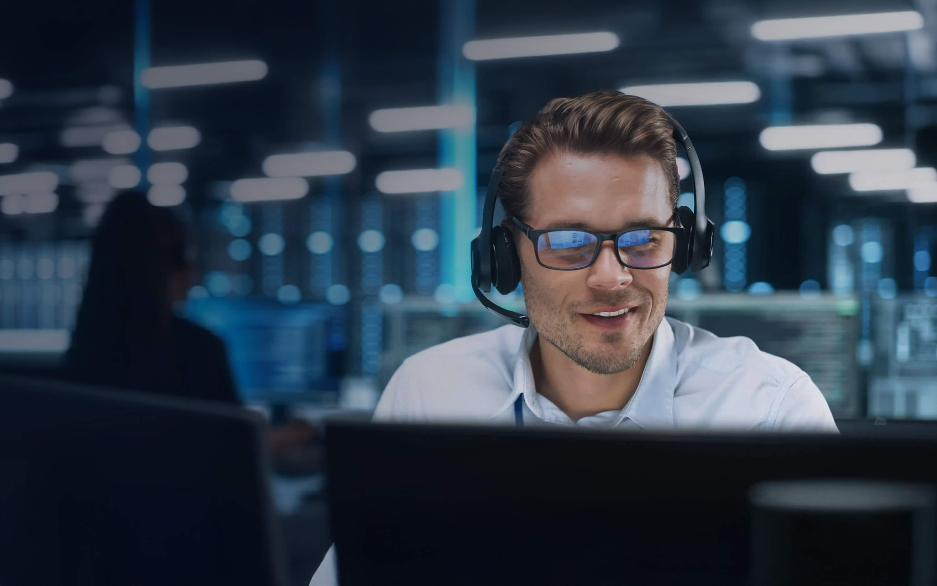 Man with headset working on his computer