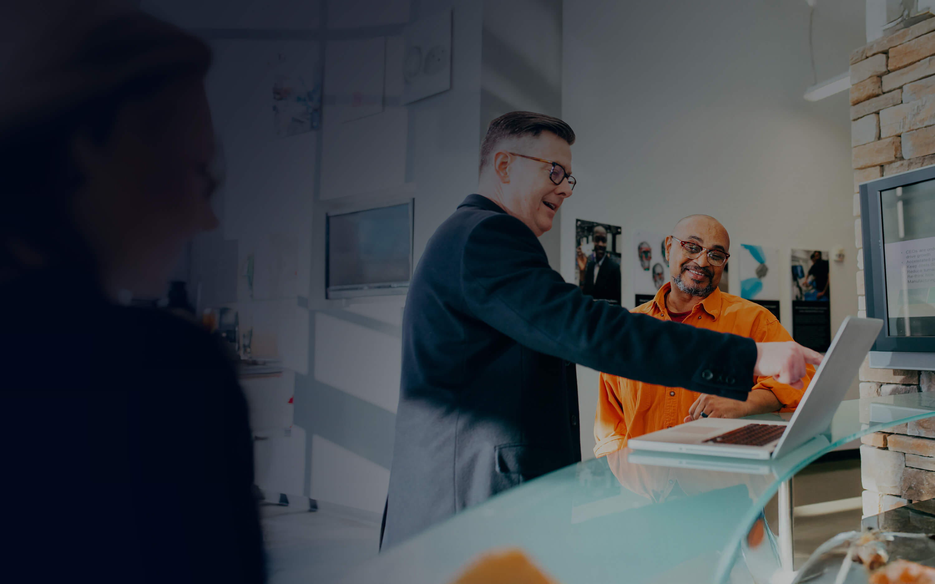 Someone teaching another person how to do something on their computer