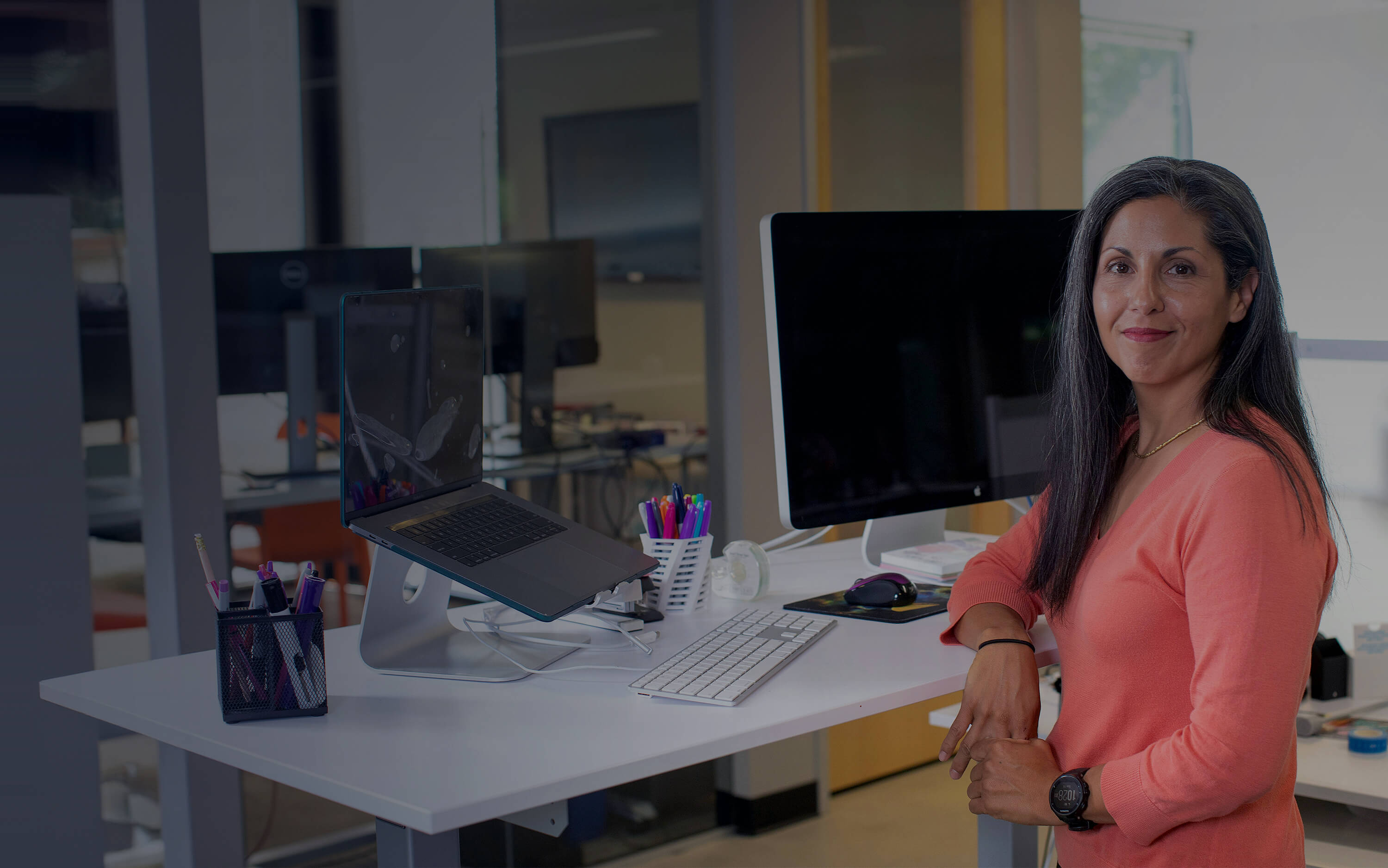 Woman sitting in front of her desk