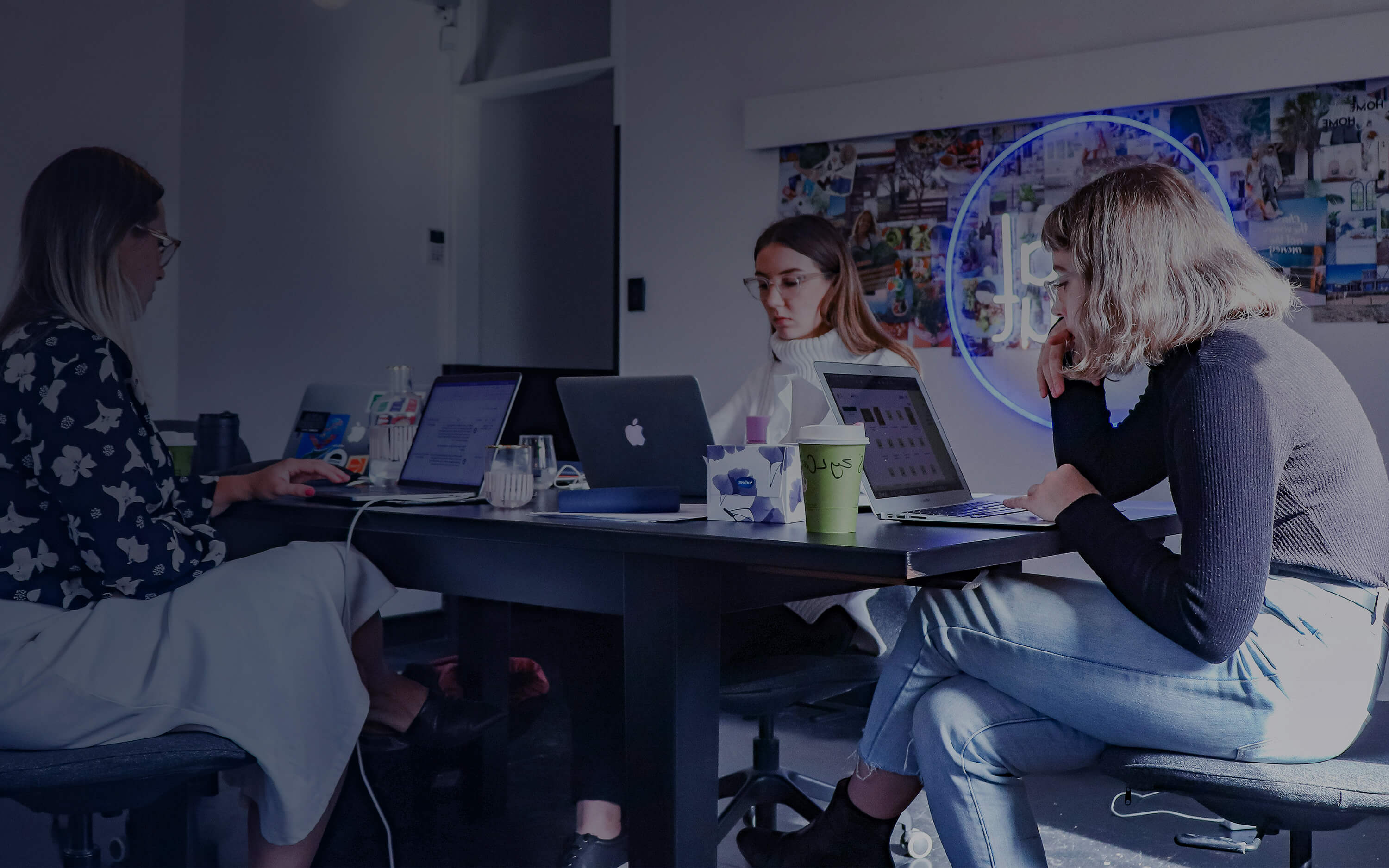 Team Working on Macs in a Modern Office