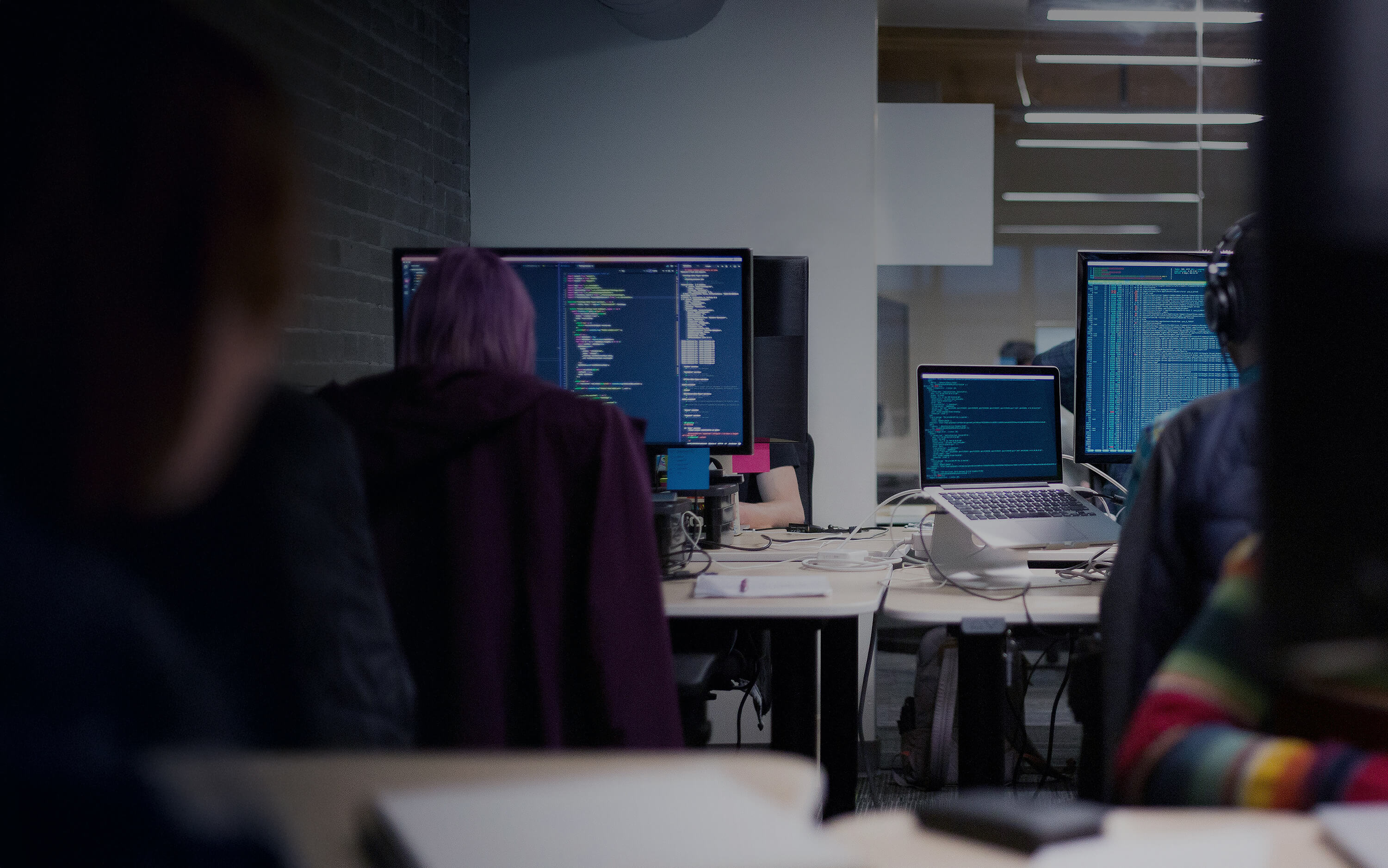 People writing code on their computers