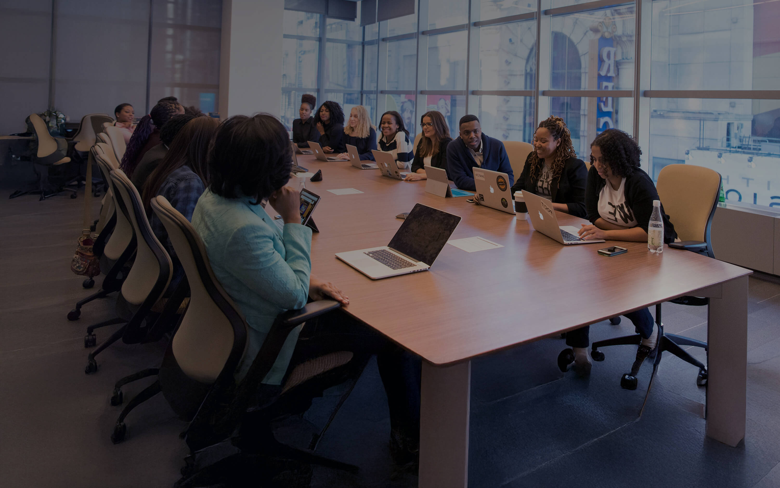 People Sitting around a Boardroom